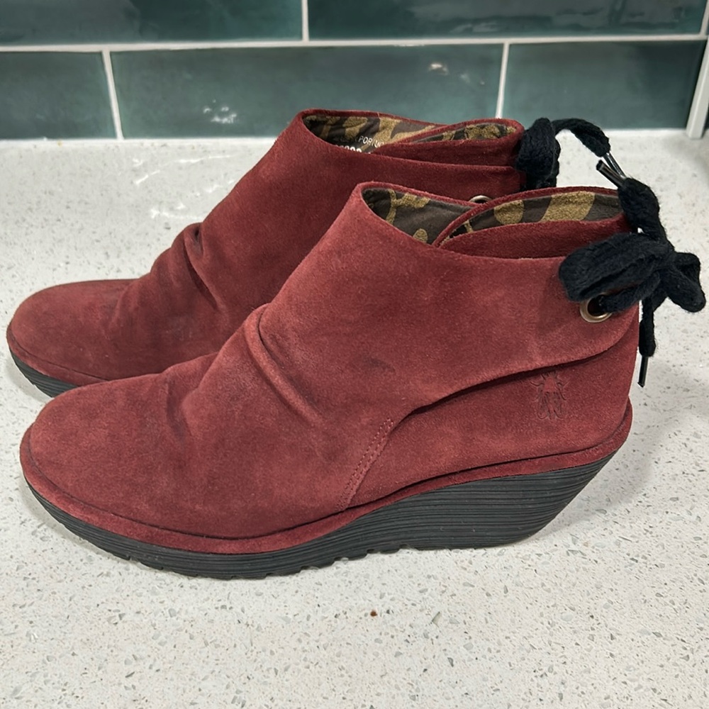 Unique maroon/rust suede color Fly London Yama wedge boots in size 10.